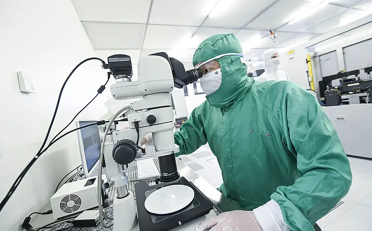 Person in protective clothing testing in Lab