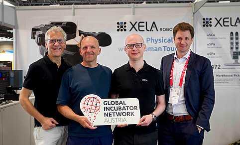 Vertreter:innen von XELA Robotics, GIN und ABA auf der ICRA-Konferenz