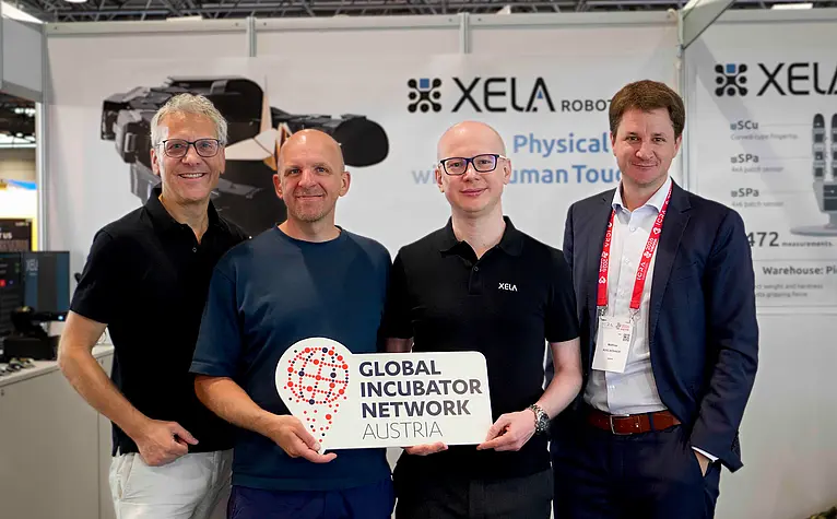 Vertreter:innen von XELA Robotics, GIN und ABA auf der ICRA-Konferenz 