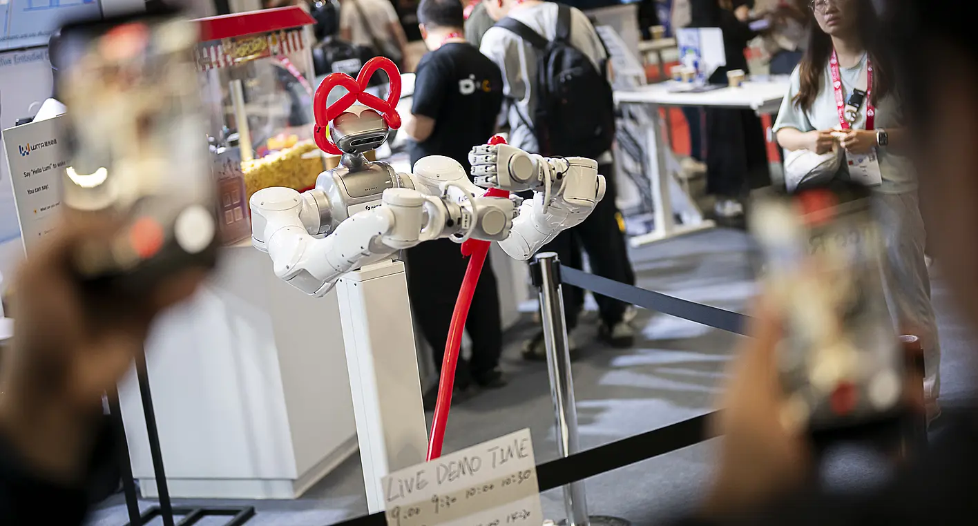 An Agibot robot demonstrates dexterity at the ICRA in Vienna by tying balloon animals.
