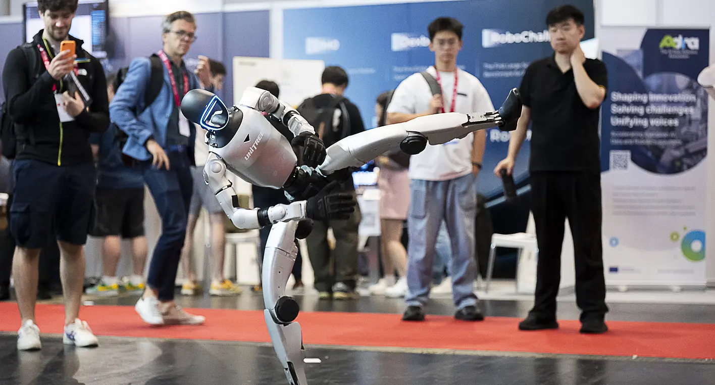 The humanoid robot from Unitree Robotics demonstrates its ability to maintain balance.