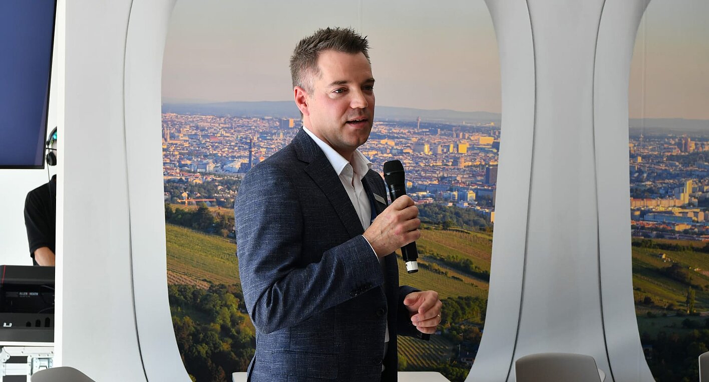 Alexandre Prévost, President of Civil Aviation at CAE, speaks at an event in Vienna.
