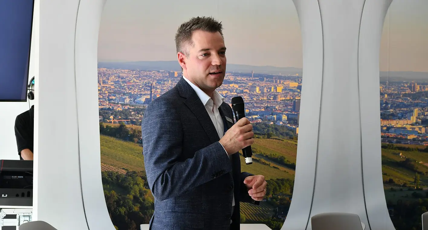 Alexandre Prévost, President of Civil Aviation at CAE, speaks at an event in Vienna.